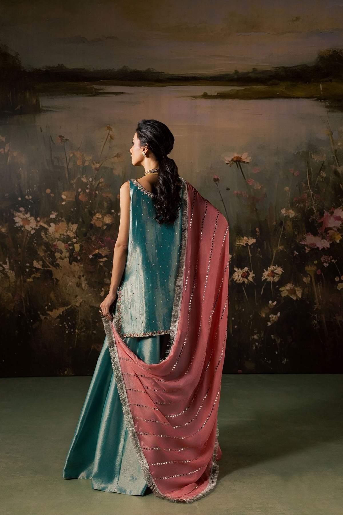 Back view of the Firouzeh ensemble showing the pink mukesh dupatta draped over the shoulder with mirrored border