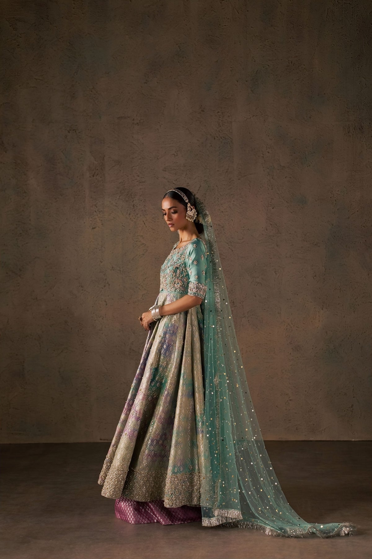 Zonaira Ahmed Gulrukh teal wedding formal 3-piece – calm standing side profile with the dupatta trailing behind
