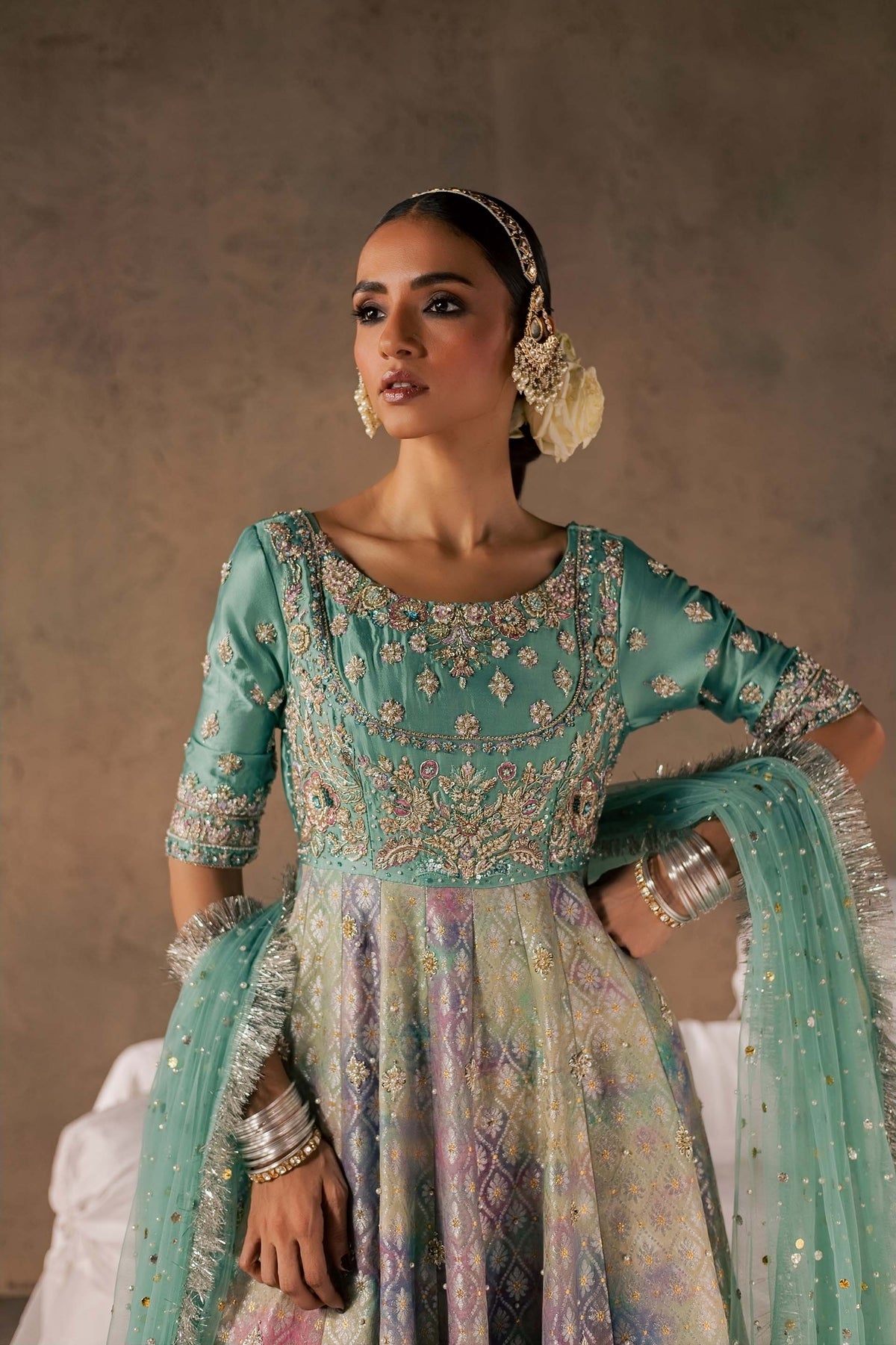 Zonaira Ahmed Gulrukh teal wedding formal 3-piece – hand-on-hip three-quarter view showing the bodice and skirt