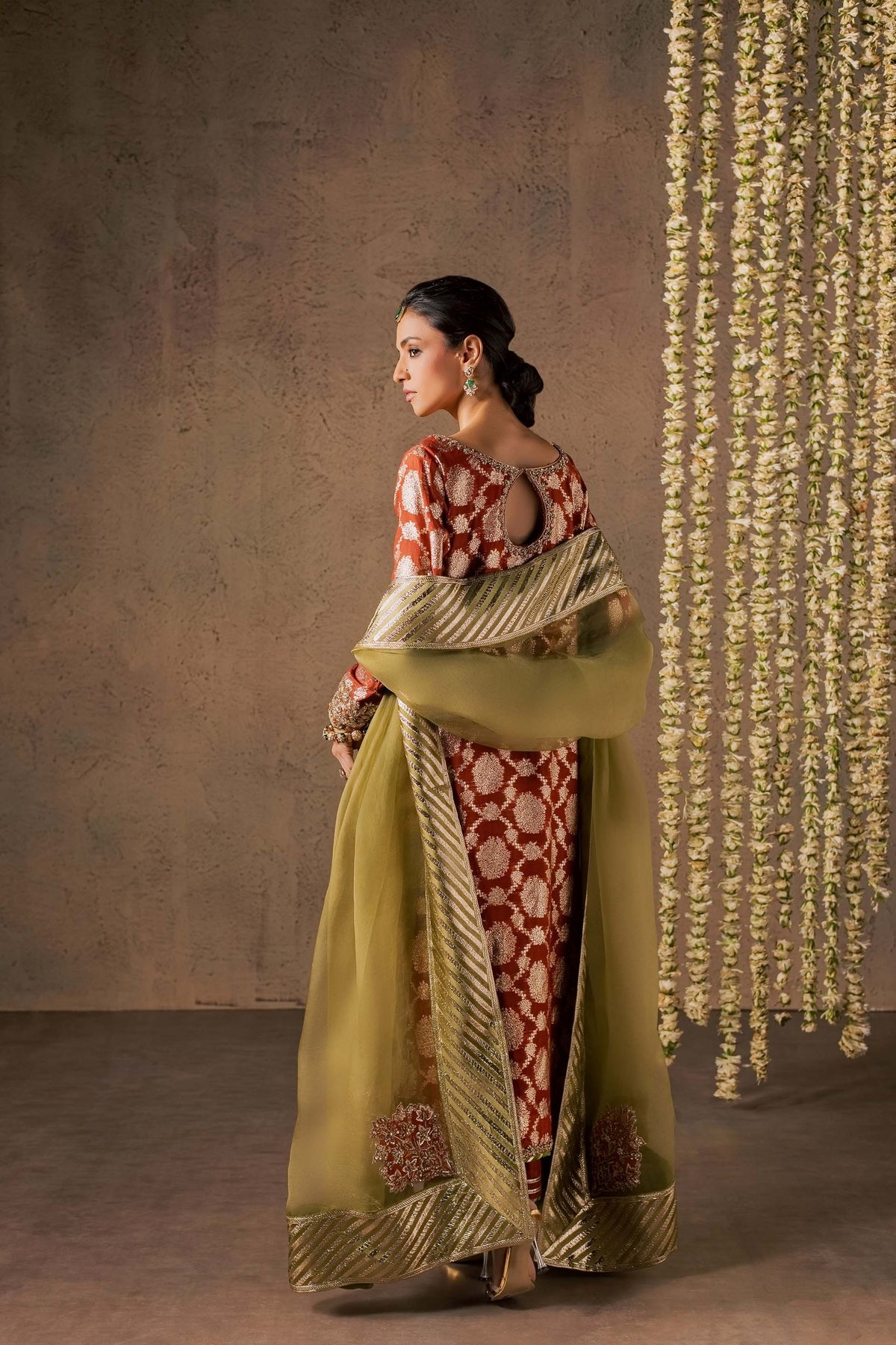 Zonaira Ahmed Mehr rust gold wedding formal 3-piece – side profile showing the keyhole back cutout and draped dupatta