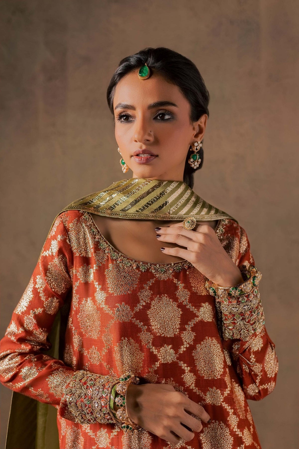 Zonaira Ahmed Mehr rust gold wedding formal 3-piece – bust portrait showing the embroidered neckline and gold jewelry
