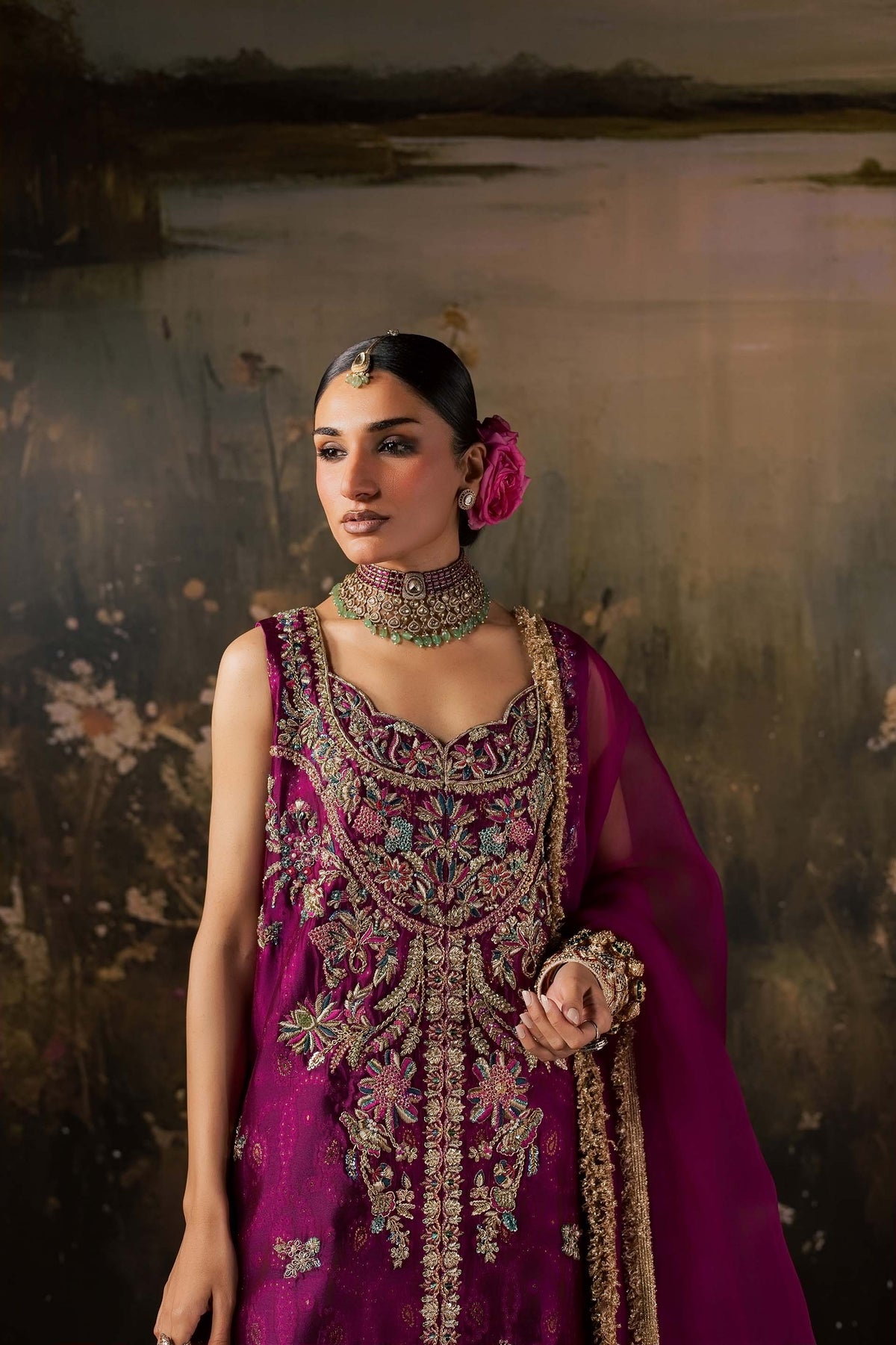 Zonaira Ahmed Rania magenta teal wedding formal 3-piece – upper body portrait showing bodice embroidery and choker necklace, painted lake backdrop