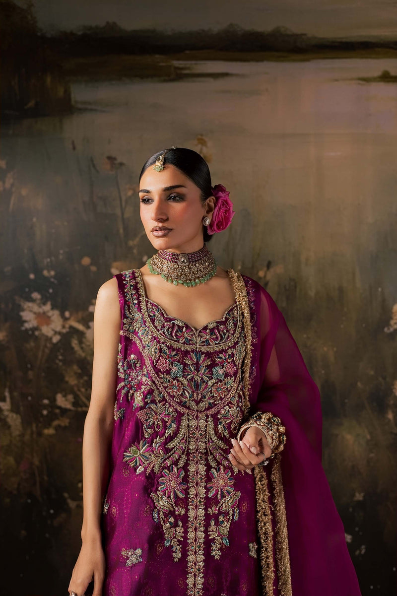 Zonaira Ahmed Rania magenta teal wedding formal 3-piece – upper body portrait showing bodice embroidery and choker necklace, painted lake backdrop