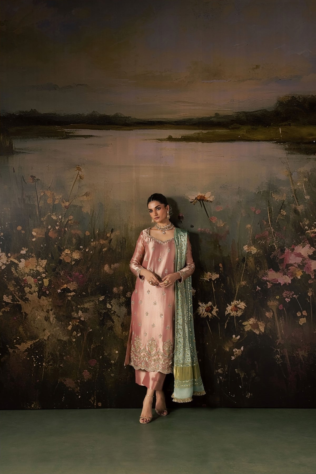Zonaira Ahmed Reem dusty rose sage wedding formal 3-piece – full-length front view with dupatta draped over shoulder, painted floral lake backdrop