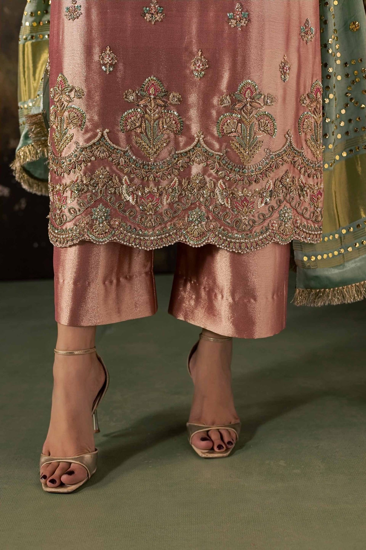 Zonaira Ahmed Reem dusty rose sage wedding formal 3-piece – close-up of embroidered scalloped hem detail with gold heeled sandals